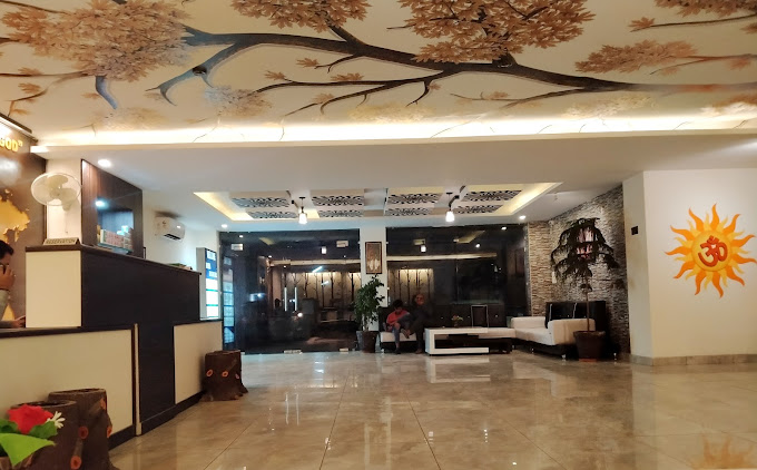 Hotel Holiday Hill Rishikesh [Modern Reception Desk At Hotel Serene Stay With Staff Greeting Guests]