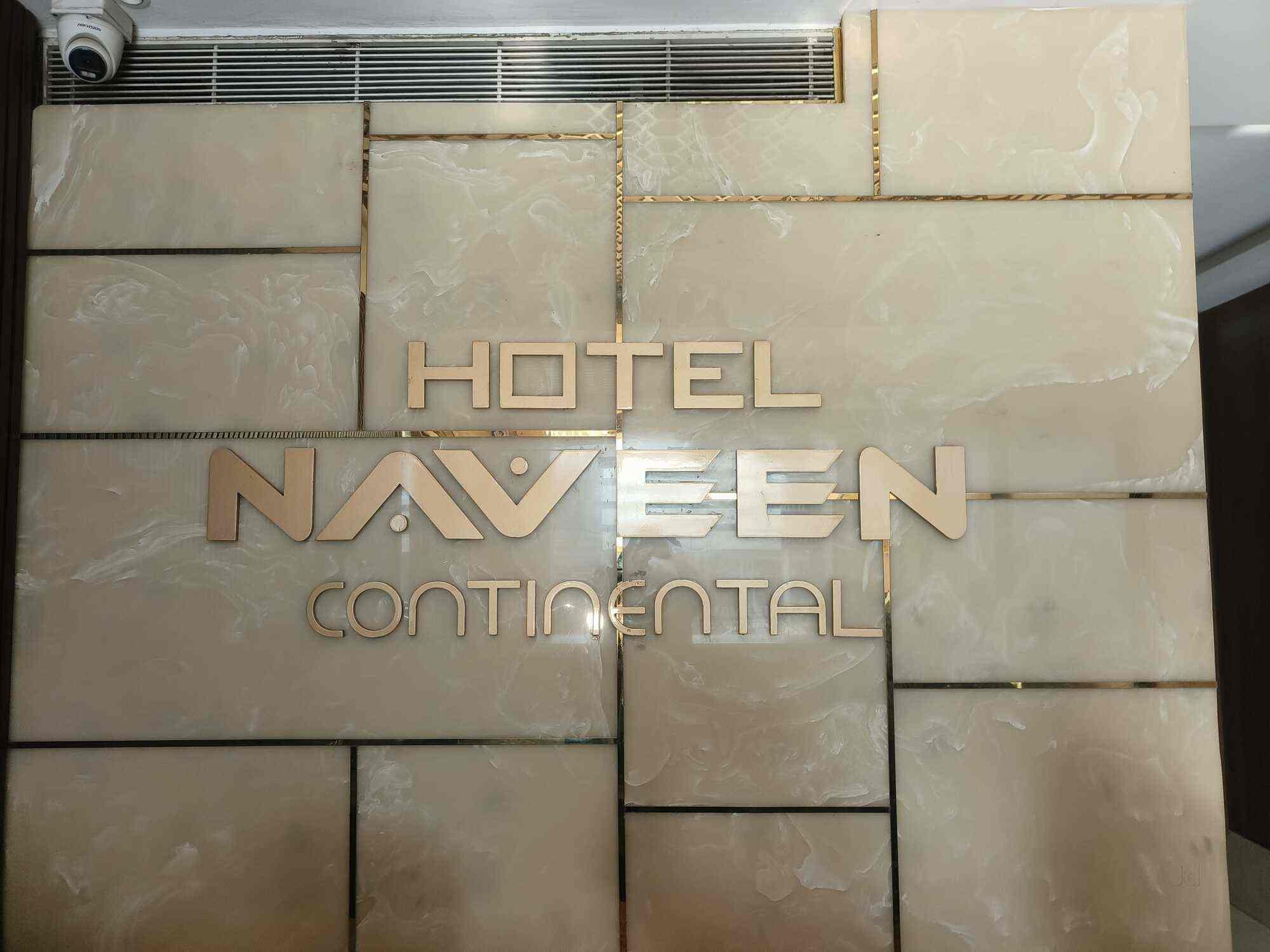 Hotel Naveen Continental Prayagraj [Main Entrance Of Hotel Naveen Continental Lit Up At Night, Showcasing The Architectural Facade.]